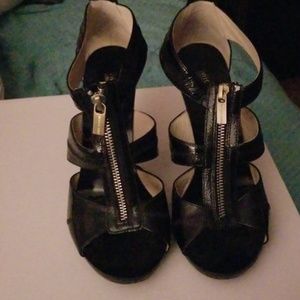 Open toe zipper front heels.